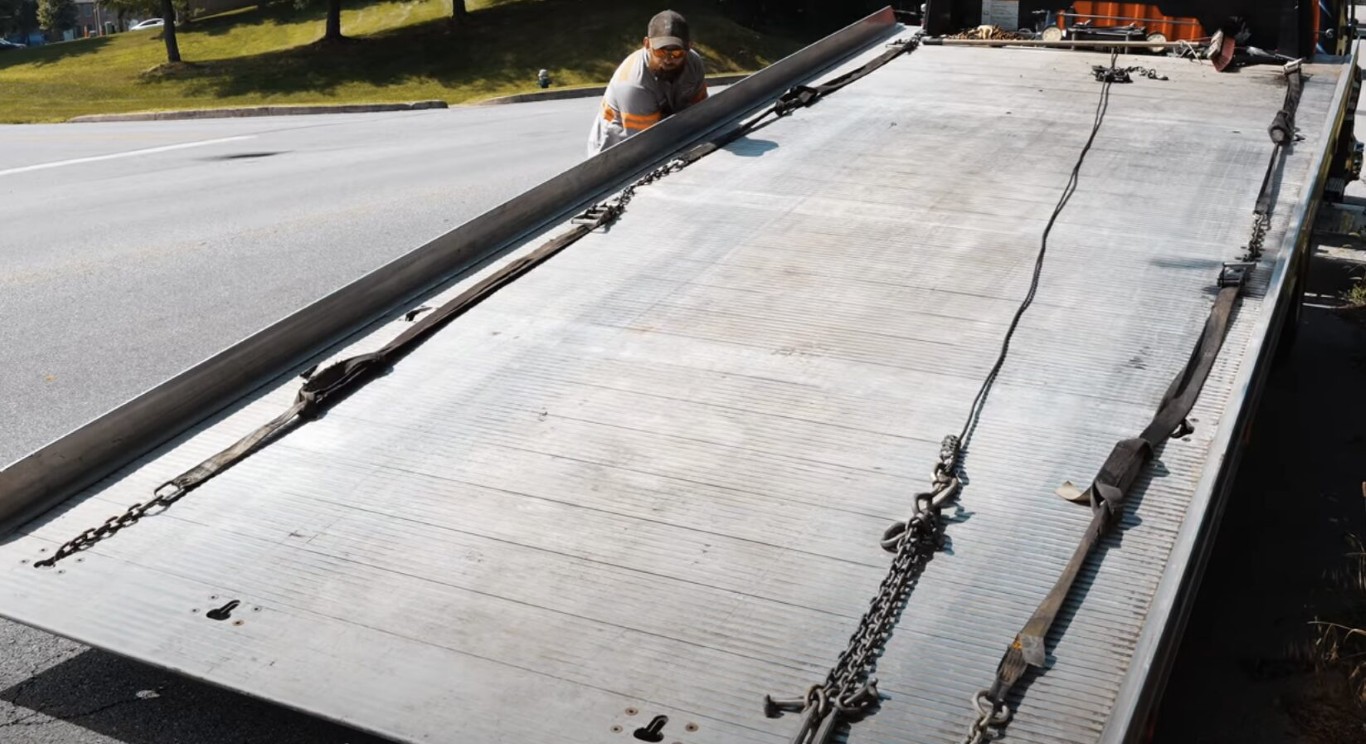 Flatbed tow truck ready for safe vehicle transport in Cerritos, CA